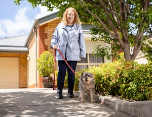 Woman walking a dog on a leash